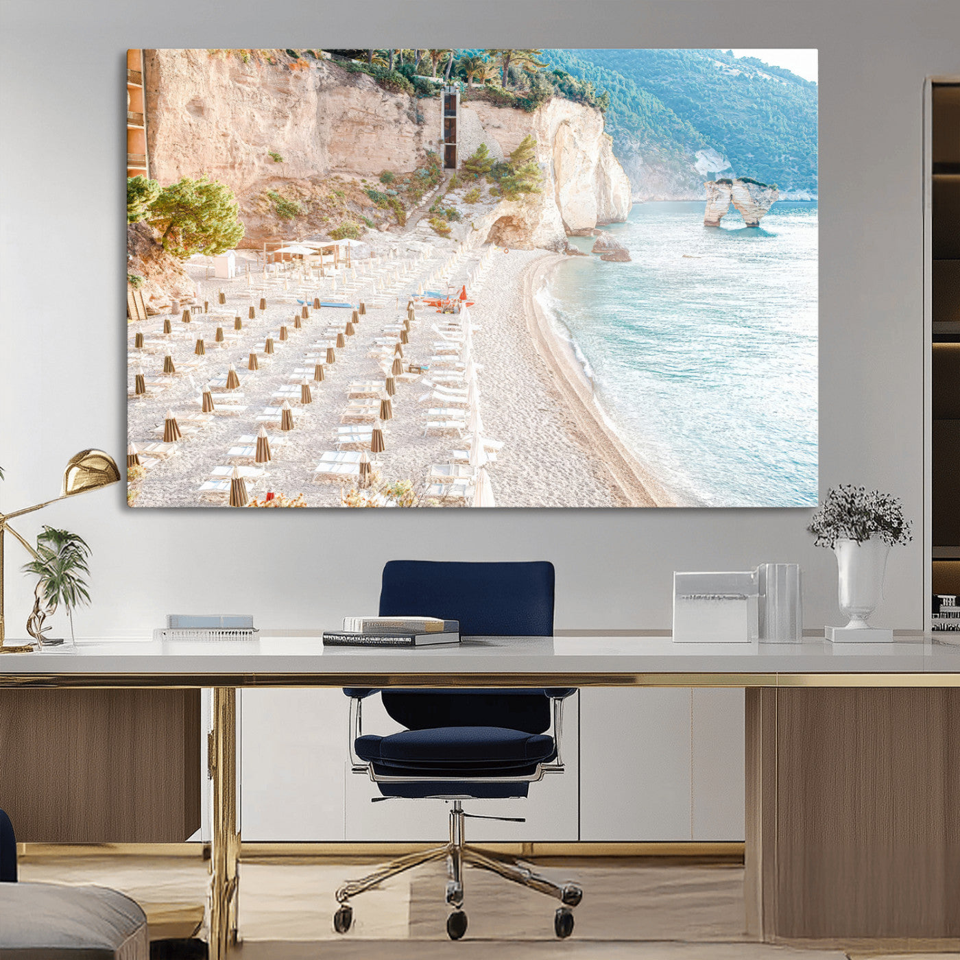 Wall art of a calm Mediterranean beach with rows of sun loungers and umbrellas in soft pastel tones, perfect for light coastal or vacation-themed decor.