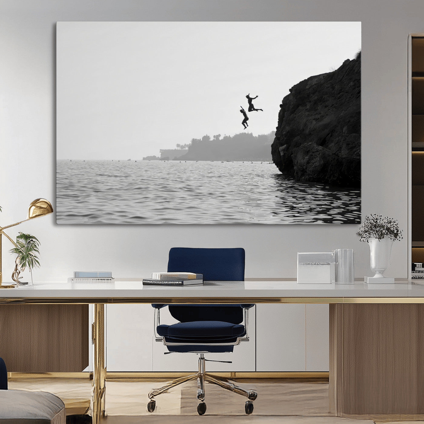 Black and white canvas of two figures cliff jumping into the sea, captured with moody tones, ideal for modern coastal or adventure-themed home decor.   2/2