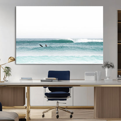 Minimalist photo of a lone surfer on calm aqua waves under bright sky, perfect for Scandinavian coastal or serene ocean-inspired home decor.