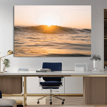 Ocean waves glowing under a warm golden sunset, reflecting soft light and calm movement, perfect for warm minimalist coastal interiors.