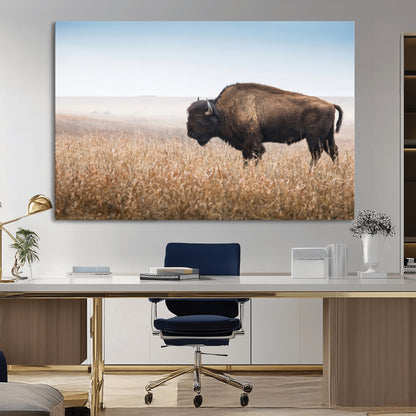 A majestic bison standing in an open prairie field, its strong form blending into the golden grass under a vast blue sky, evoking the wild spirit of the American plains.