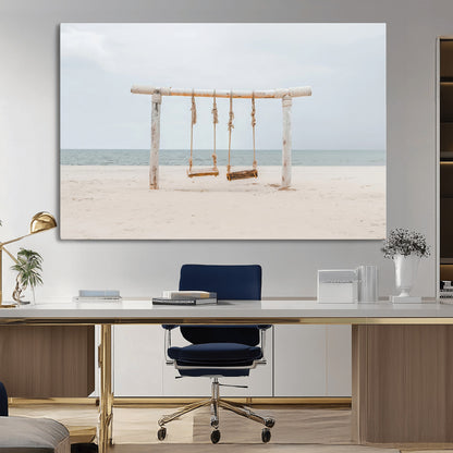 A rustic wooden beach swing stands on a serene sandy shore with an ocean horizon in the background, creating a tranquil and dreamy coastal escape.