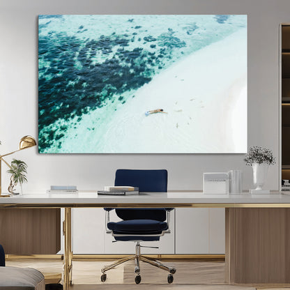 Canvas featuring an aerial view of a swimmer in shallow turquoise waters with coral patterns, ideal for tropical coastal home decor.