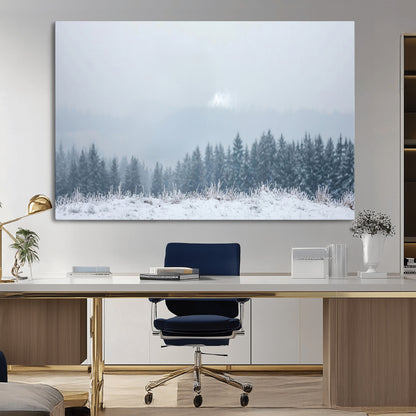 Snow-covered forest under misty sky, soft light breaking through clouds, ideal for minimalist or Nordic-inspired home decor.