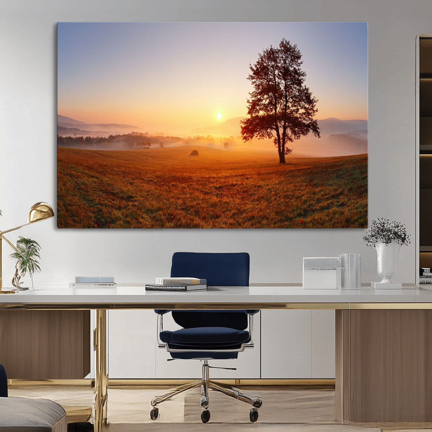 A tranquil landscape at sunrise with a mist-covered field and a lone tree, creating a peaceful and natural atmosphere.