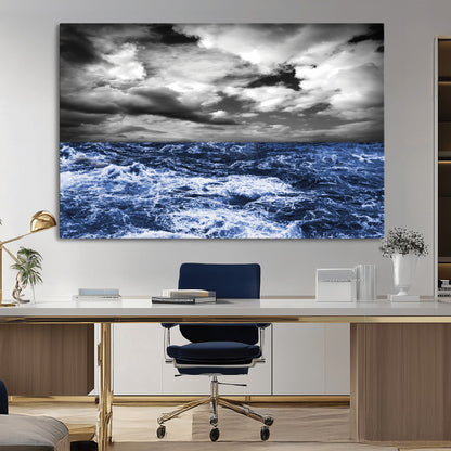 Moody canvas wall art of a stormy ocean under a dramatic black-and-white sky, perfect for bold or coastal-style interiors.