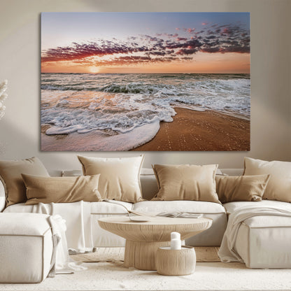 Canvas of a sunset over a foamy ocean shore with warm light and gentle waves, ideal for coastal or beach-themed home decor.