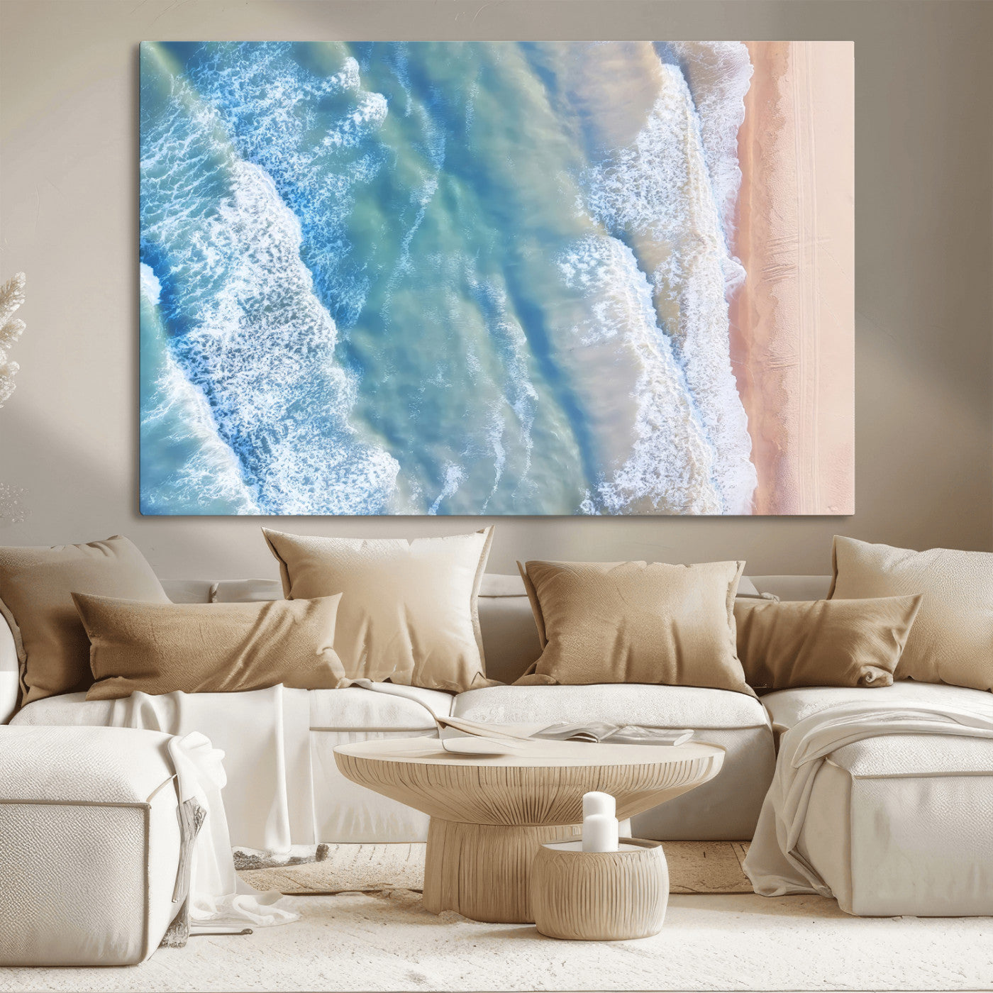 Aerial photo of soft blue waves meeting sandy shore, perfect for modern coastal or beach-themed decor with a light and tranquil aesthetic.