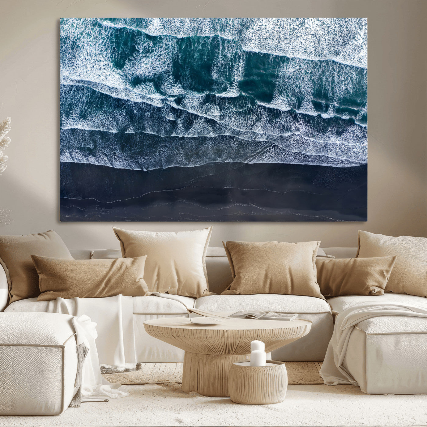 Canvas of aerial ocean waves crashing onto a black sand beach in moody tones, ideal for modern coastal or minimalist home decor.