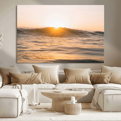 Ocean waves glowing under a warm golden sunset, reflecting soft light and calm movement, perfect for warm minimalist coastal interiors.