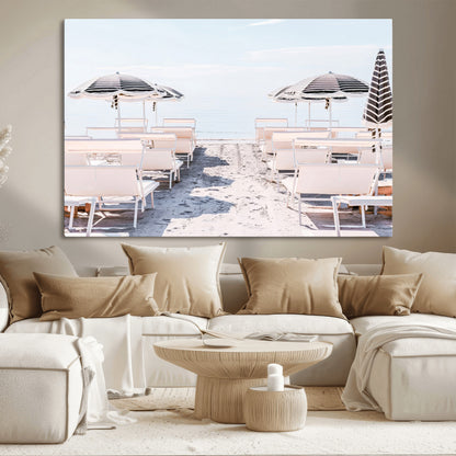 A serene minimalist beach scene featuring striped umbrellas, soft pastel sand, and an elegant lounge setup, creating a tranquil and stylish coastal retreat.