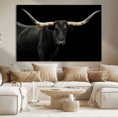 Close-up of a black Texas longhorn with large curved horns on black background, ideal for rustic farmhouse or modern western interiors.