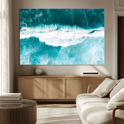 Aerial view of turquoise ocean waves crashing with white foam, perfect for tropical coastal or modern beach-style home decor.