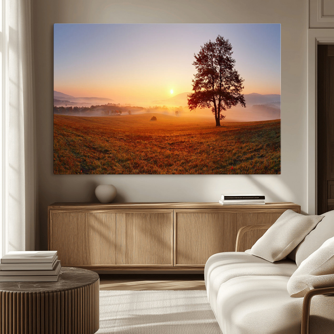 A tranquil landscape at sunrise with a mist-covered field and a lone tree, creating a peaceful and natural atmosphere.