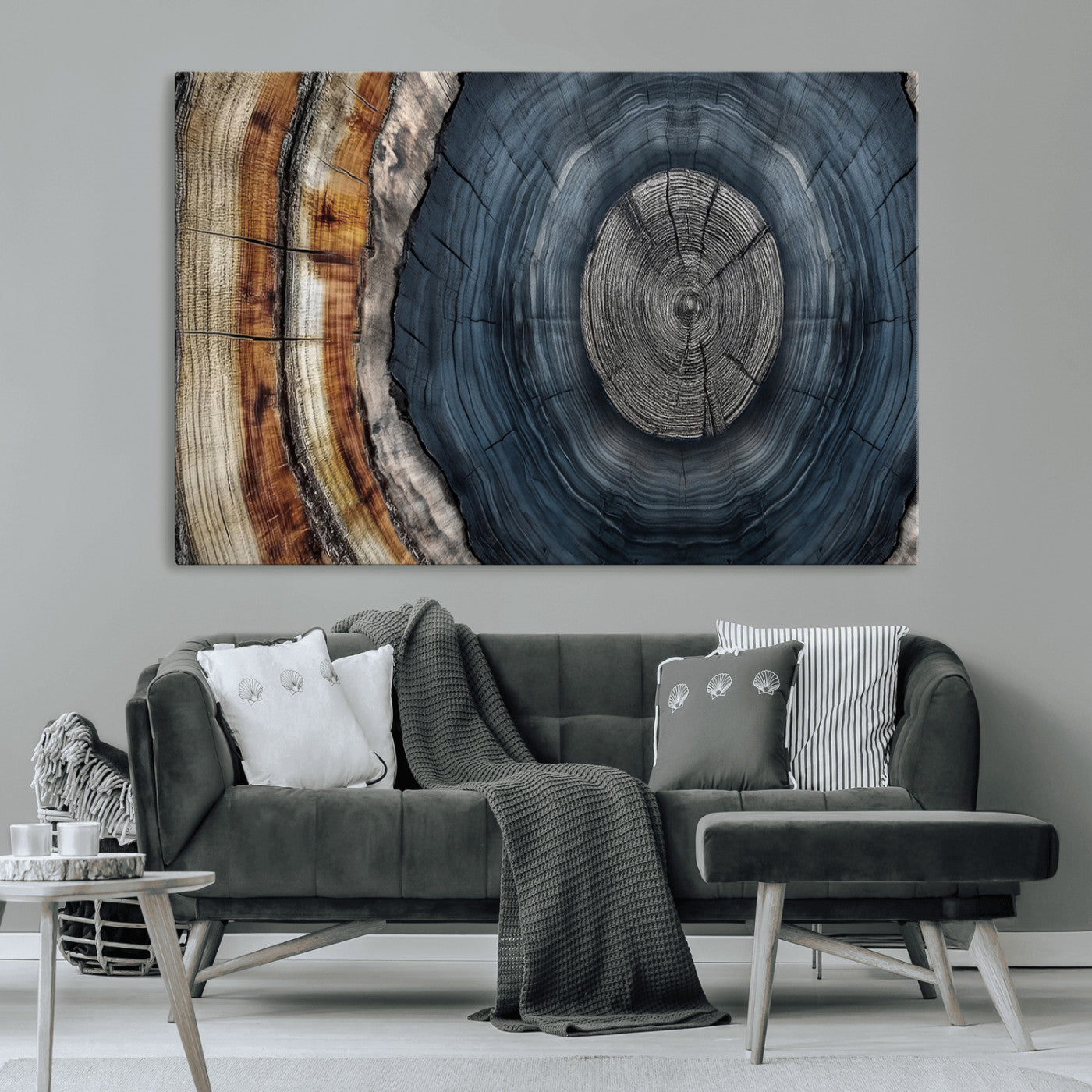 A stunning close-up of a tree trunk showing the intricate, circular growth rings, showcasing the natural textures and rich contrasts in deep blues, browns, and silvers.