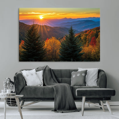 Vibrant sunset over autumn mountains with colorful trees and warm light, ideal for nature lovers or cabin-style wall decor.