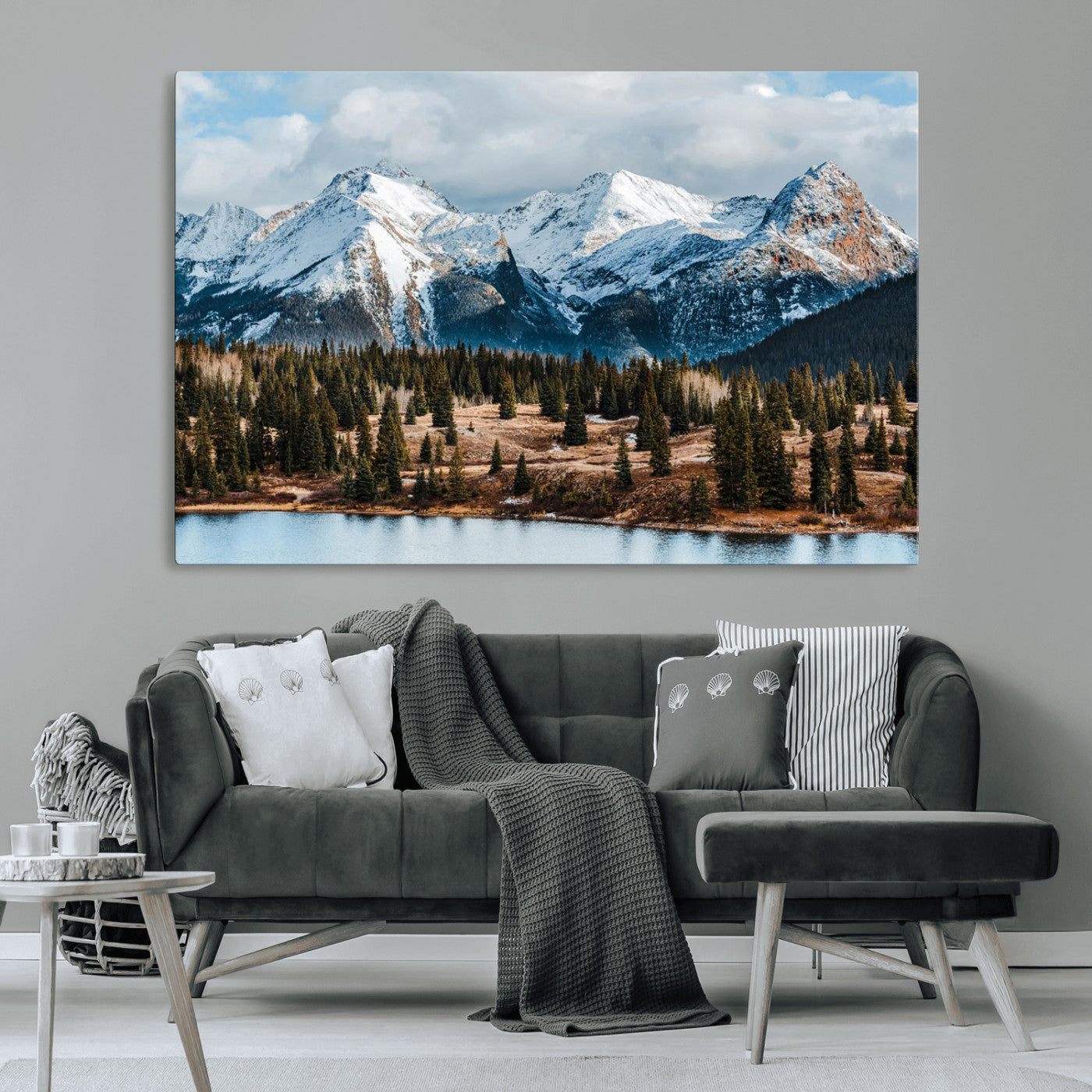 Framed canvas of snowy mountain peaks with pine forest and alpine lake, perfect for winter cabin or wilderness-inspired home decor.