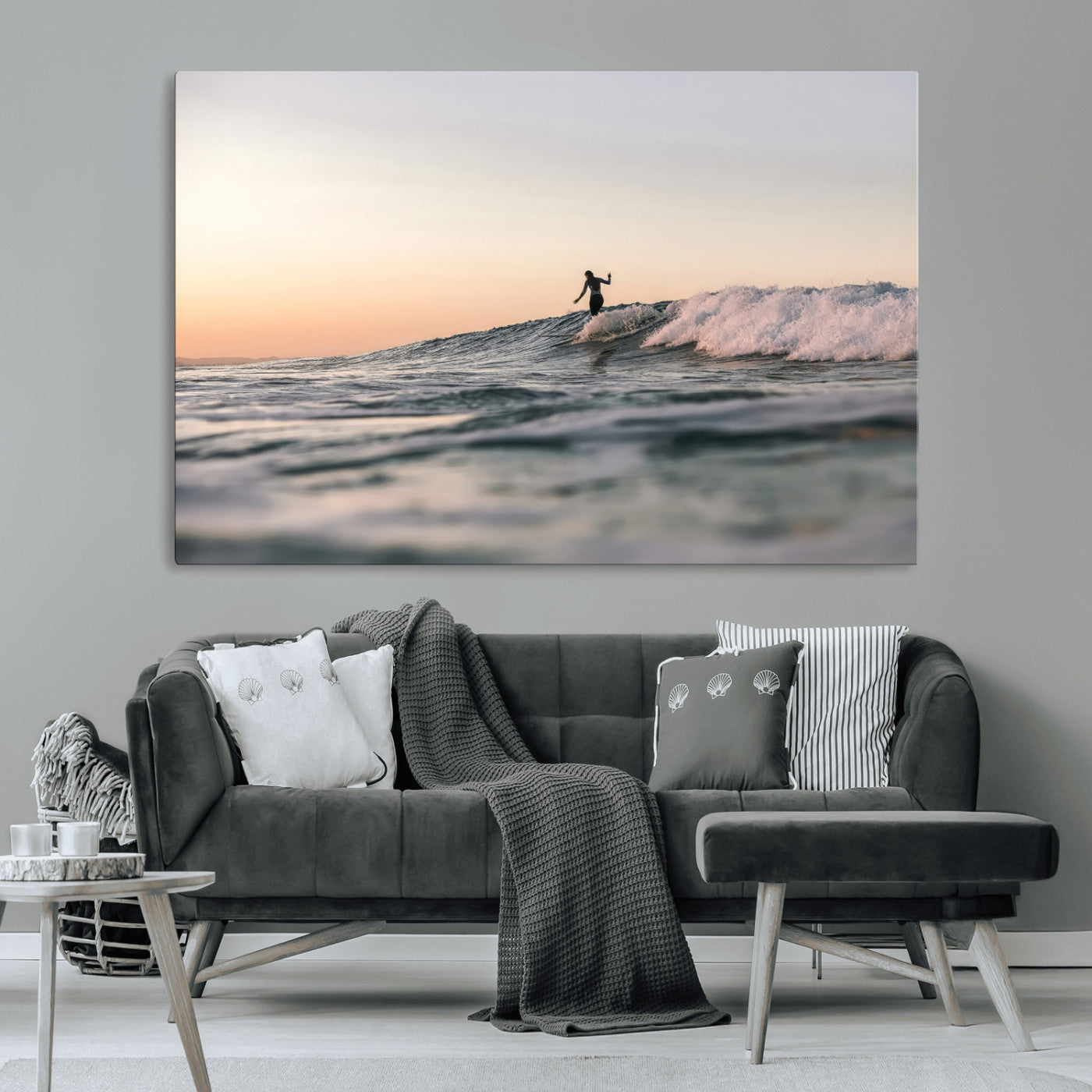 Framed canvas of a female surfer balancing on a wave at sunset, perfect for serene surf or ocean-inspired coastal decor.