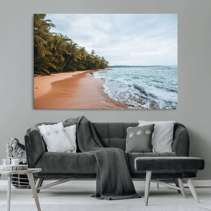 Framed canvas of a tropical beach with palm trees and soft waves, ideal for coastal escape or serene nature-inspired home decor.