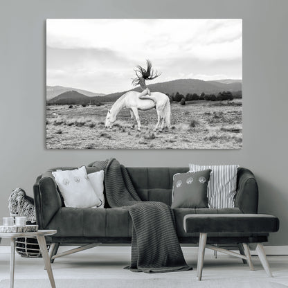 Black and white photo of a woman on a white horse in moody tones, ideal for Western Boho or modern rustic-style home decor.