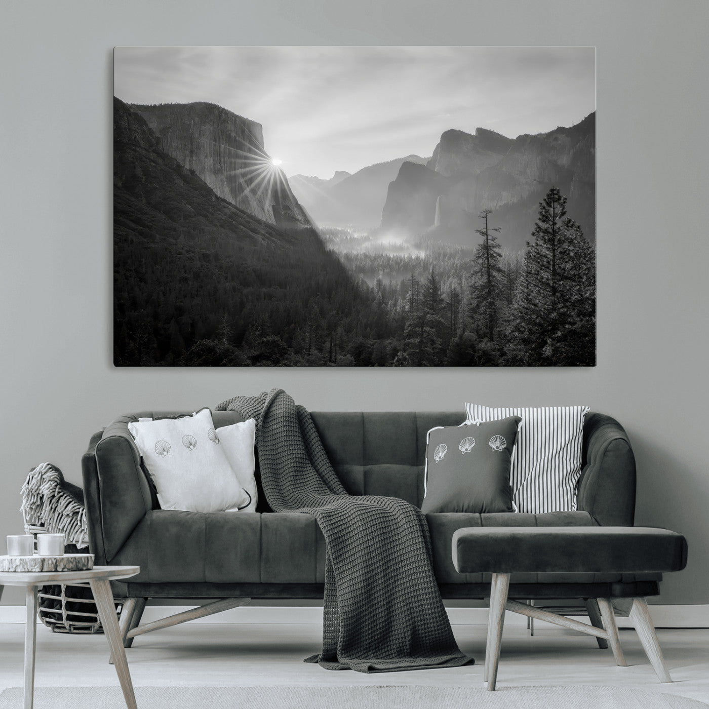Black and white landscape of Yosemite with sun rays peeking over El Capitan, ideal for moody nature or modern rustic decor.