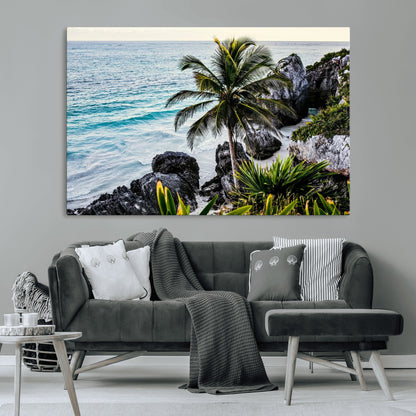 Framed canvas of a vibrant tropical coastline with palm trees, rocky cliffs, and turquoise waters, ideal for tropical coastal home decor.