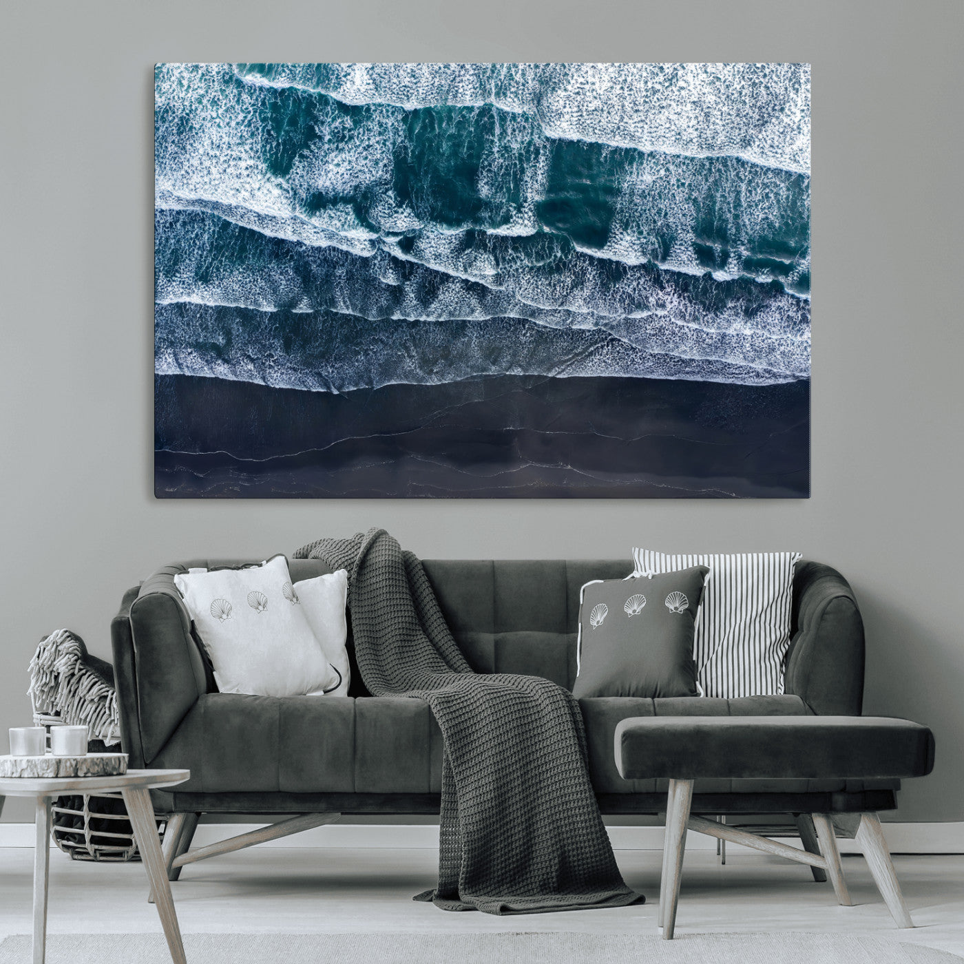Canvas of aerial ocean waves crashing onto a black sand beach in moody tones, ideal for modern coastal or minimalist home decor.