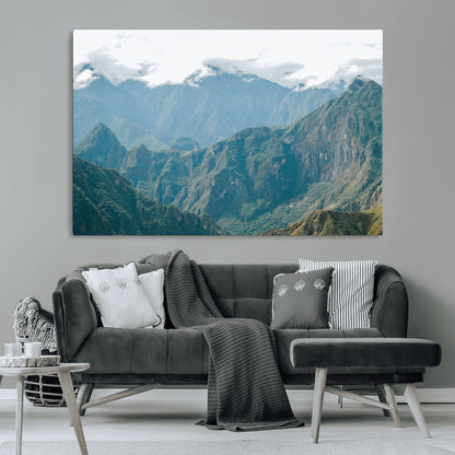A misty mountain landscape with cloud-covered Andean peaks and lush green valleys, creating a dramatic and serene view, perfect for rustic or nature-inspired home decor.