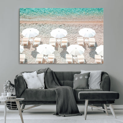 A bright beach scene with white umbrellas, pastel sand, and turquoise waters, creating a tranquil coastal vibe, perfect for beach house or summer decor.