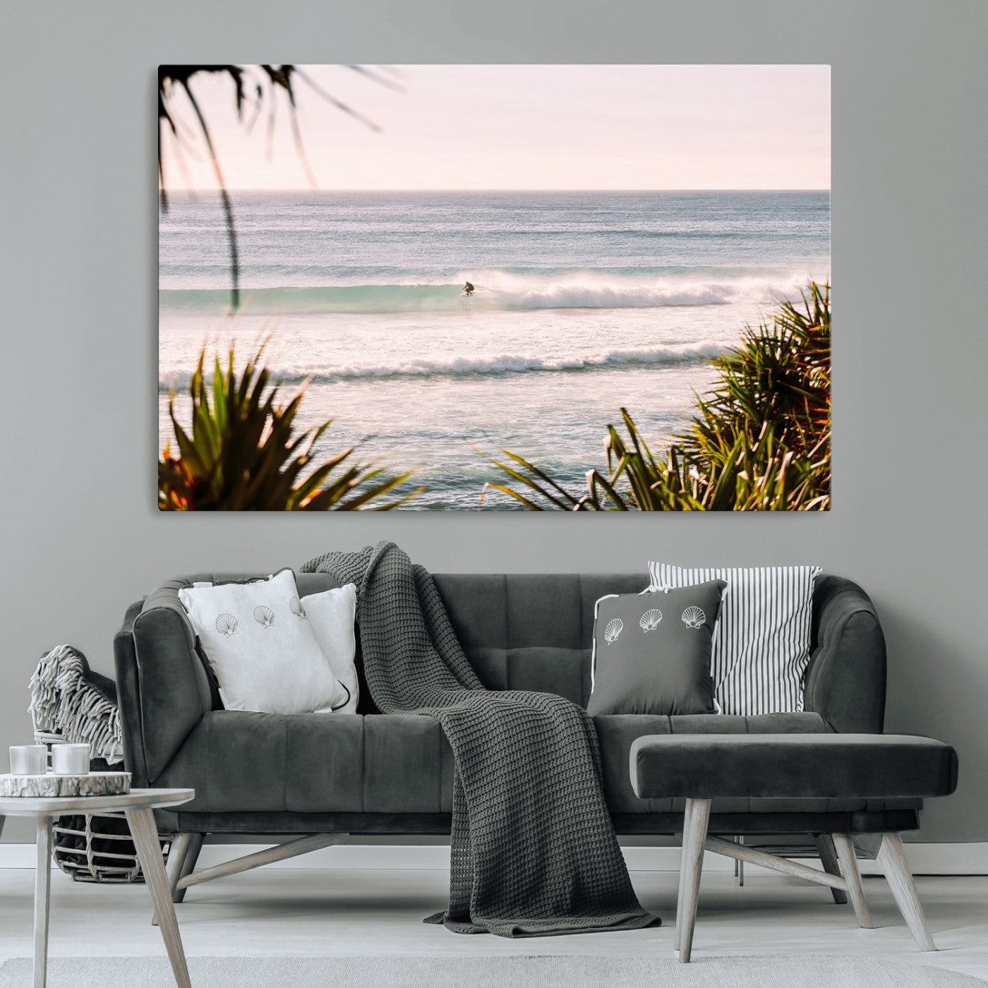 Canvas of a lone surfer riding a pastel wave at sunrise, perfect for tropical or coastal-themed spaces with a relaxed, airy vibe.