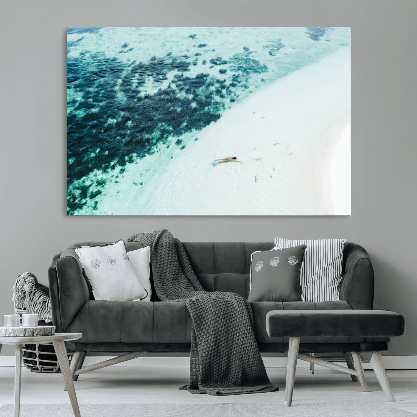Canvas featuring an aerial view of a swimmer in shallow turquoise waters with coral patterns, ideal for tropical coastal home decor.