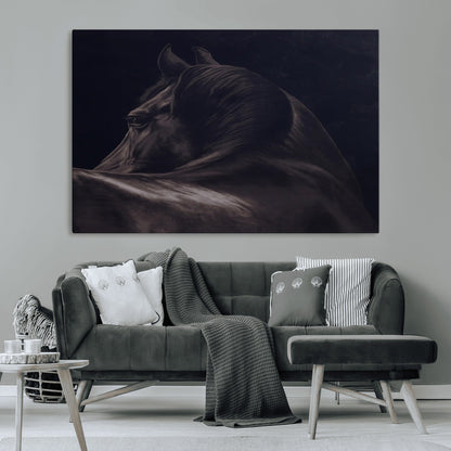 Close-up of a black horse with dramatic lighting on a dark background, perfect for rustic or masculine home decor.