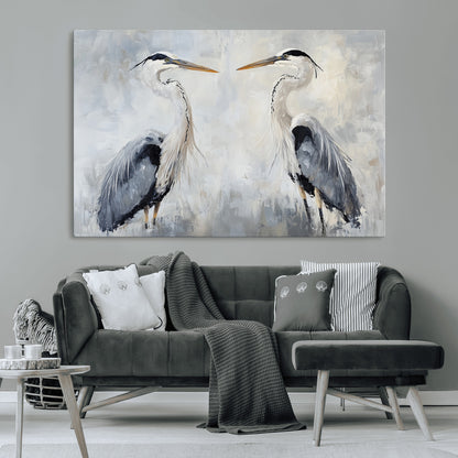 Two herons facing each other on a soft-toned background with blue-grey feathers, perfect for tranquil, coastal or nature-themed interiors.