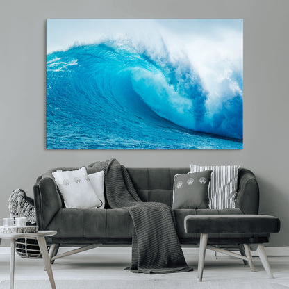 Vibrant canvas of a powerful curling ocean wave in tropical blue tones, perfect for coastal or surf-inspired decor settings.