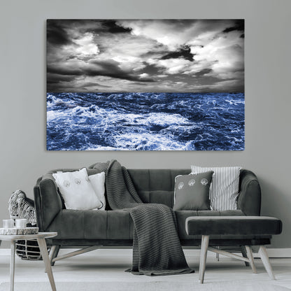 Moody canvas wall art of a stormy ocean under a dramatic black-and-white sky, perfect for bold or coastal-style interiors.