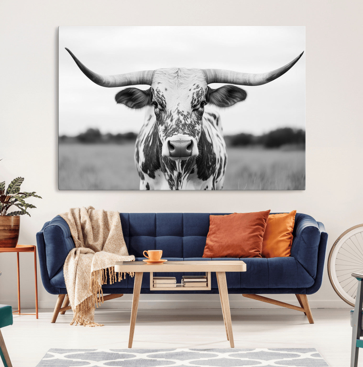 Capture the strength and elegance of nature with this striking black and white portrait of a longhorn cow. Its powerful presence makes a bold statement in any room.