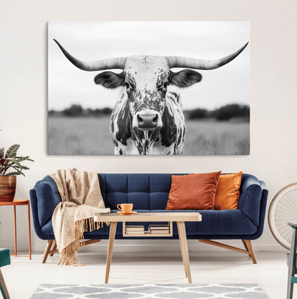 Capture the strength and elegance of nature with this striking black and white portrait of a longhorn cow. Its powerful presence makes a bold statement in any room.