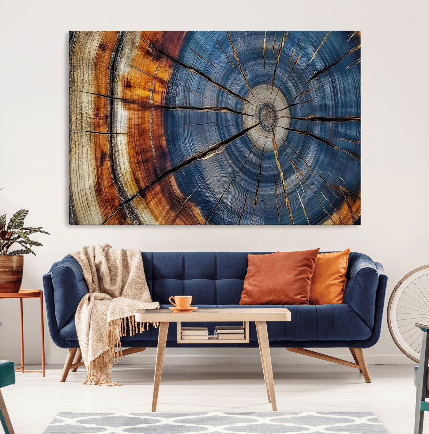 A stunning close-up view of a tree trunk, showcasing the intricate growth rings in a vibrant mix of warm browns, cool blues, and hints of natural texture.