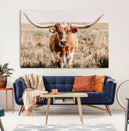 Framed longhorn cow canvas wall art with rustic prairie background, western animal print perfect for farmhouse or ranch style decor