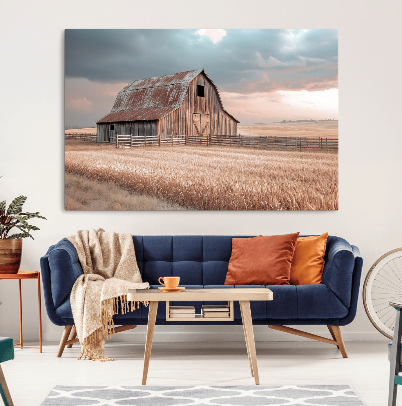 Framed canvas of a rustic barn in a golden wheat field under soft skies, ideal for vintage farmhouse or country-style wall decor.