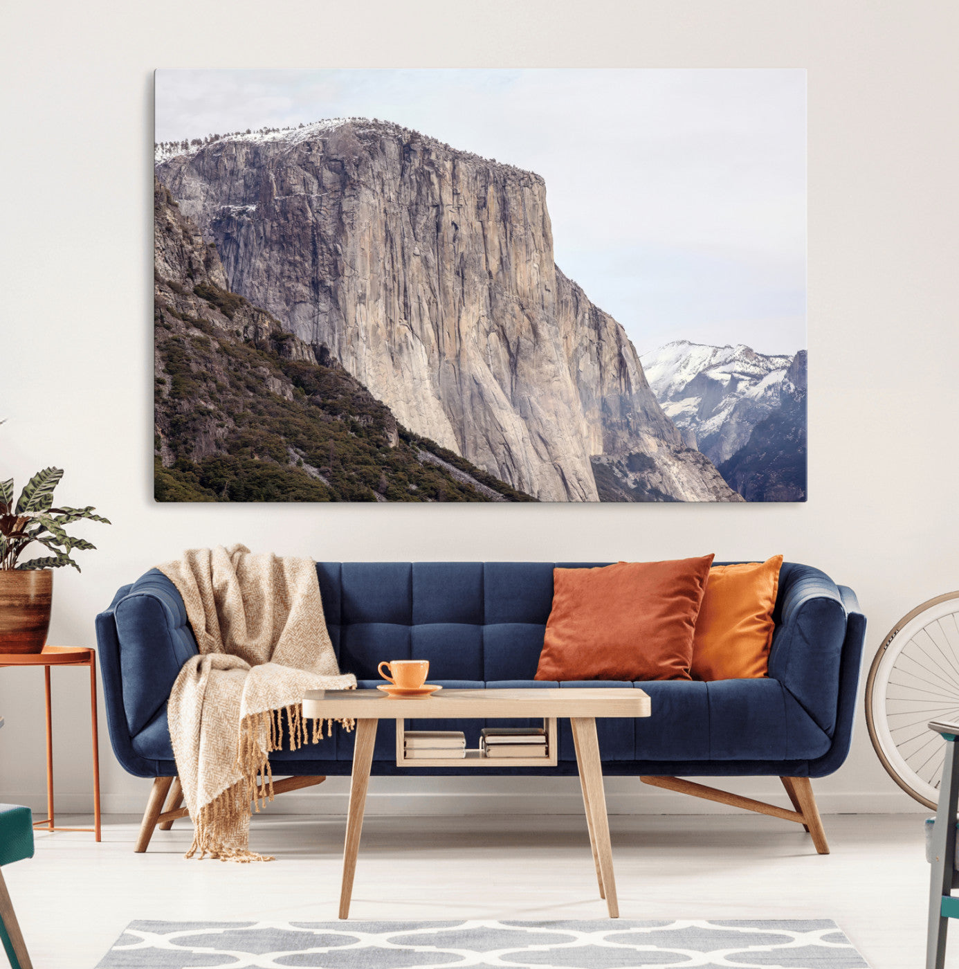 Framed canvas of El Capitan’s vertical granite face in Yosemite with snowy peaks, ideal for Sierra minimalism or mountain-inspired decor.