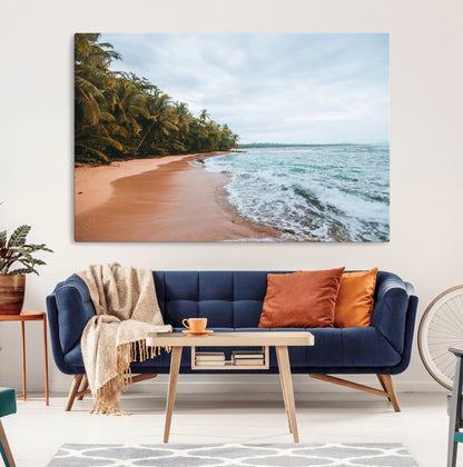 Framed canvas of a tropical beach with palm trees and soft waves, ideal for coastal escape or serene nature-inspired home decor.