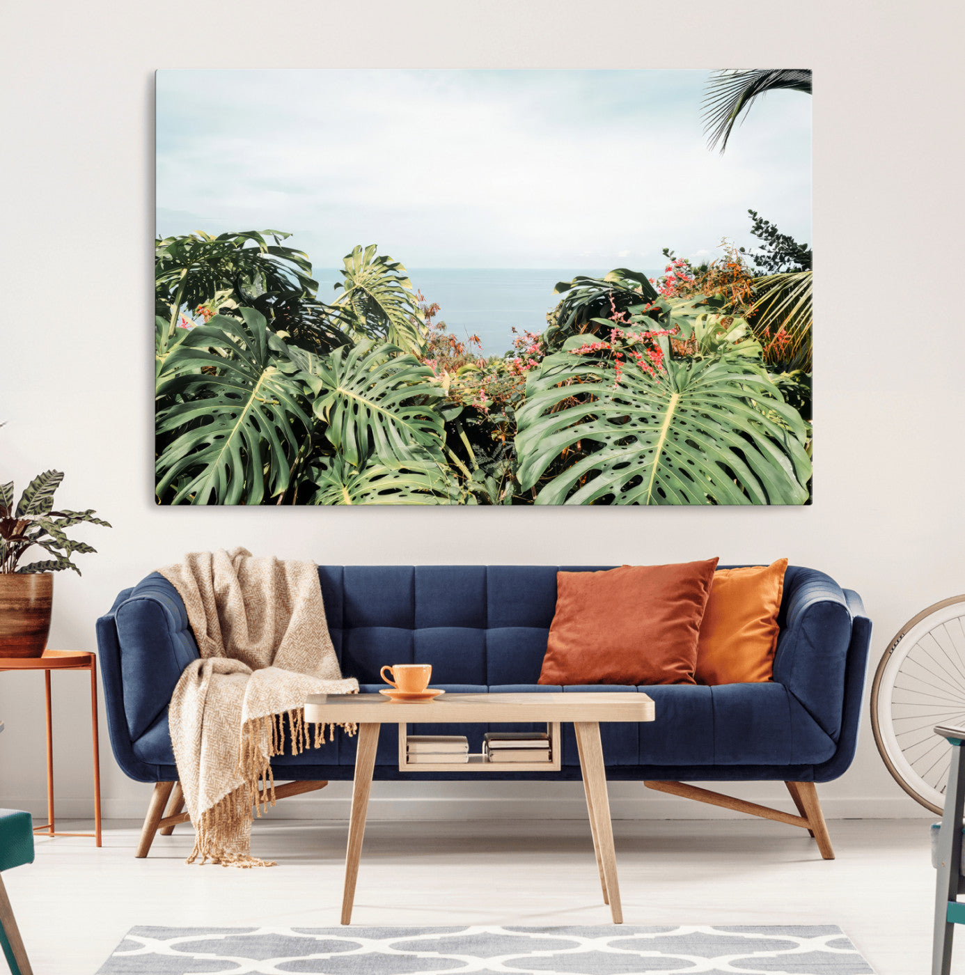 Monstera leaves and tropical flowers framing a calm ocean view, ideal for tropical coastal or exotic jungle-style interior wall decor.