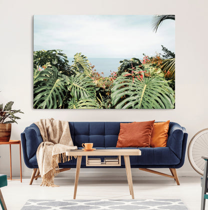 Monstera leaves and tropical flowers framing a calm ocean view, ideal for tropical coastal or exotic jungle-style interior wall decor.