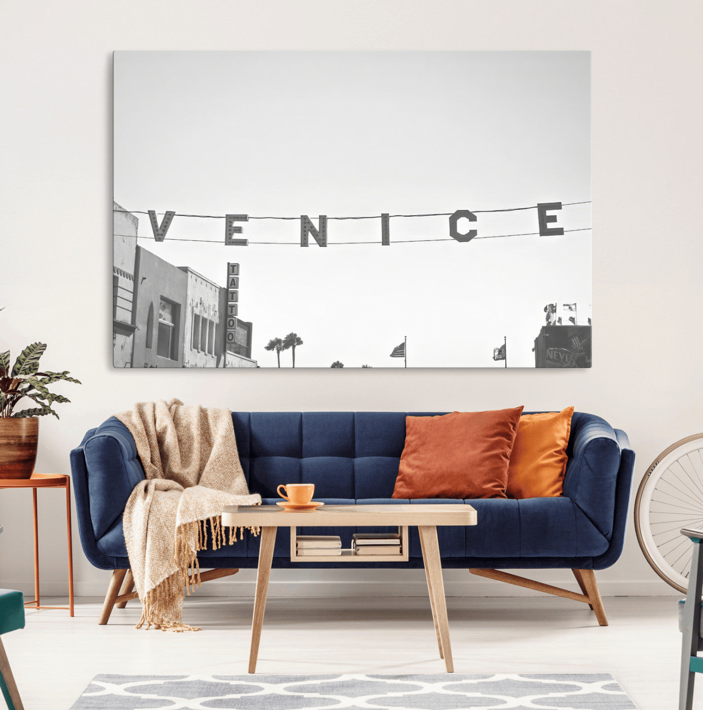 Black and white photo of Venice Beach sign and palm-lined street, perfect for urban coastal or minimalist LA-inspired wall decoration.