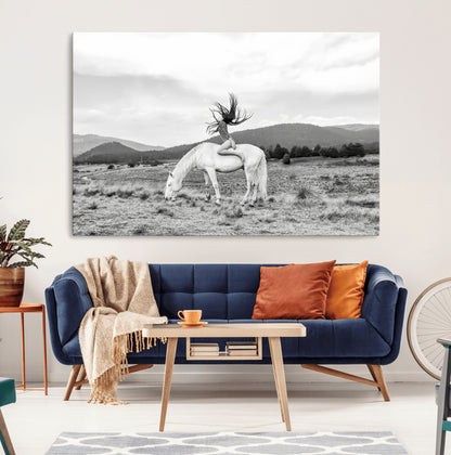 Black and white photo of a woman on a white horse in moody tones, ideal for Western Boho or modern rustic-style home decor.