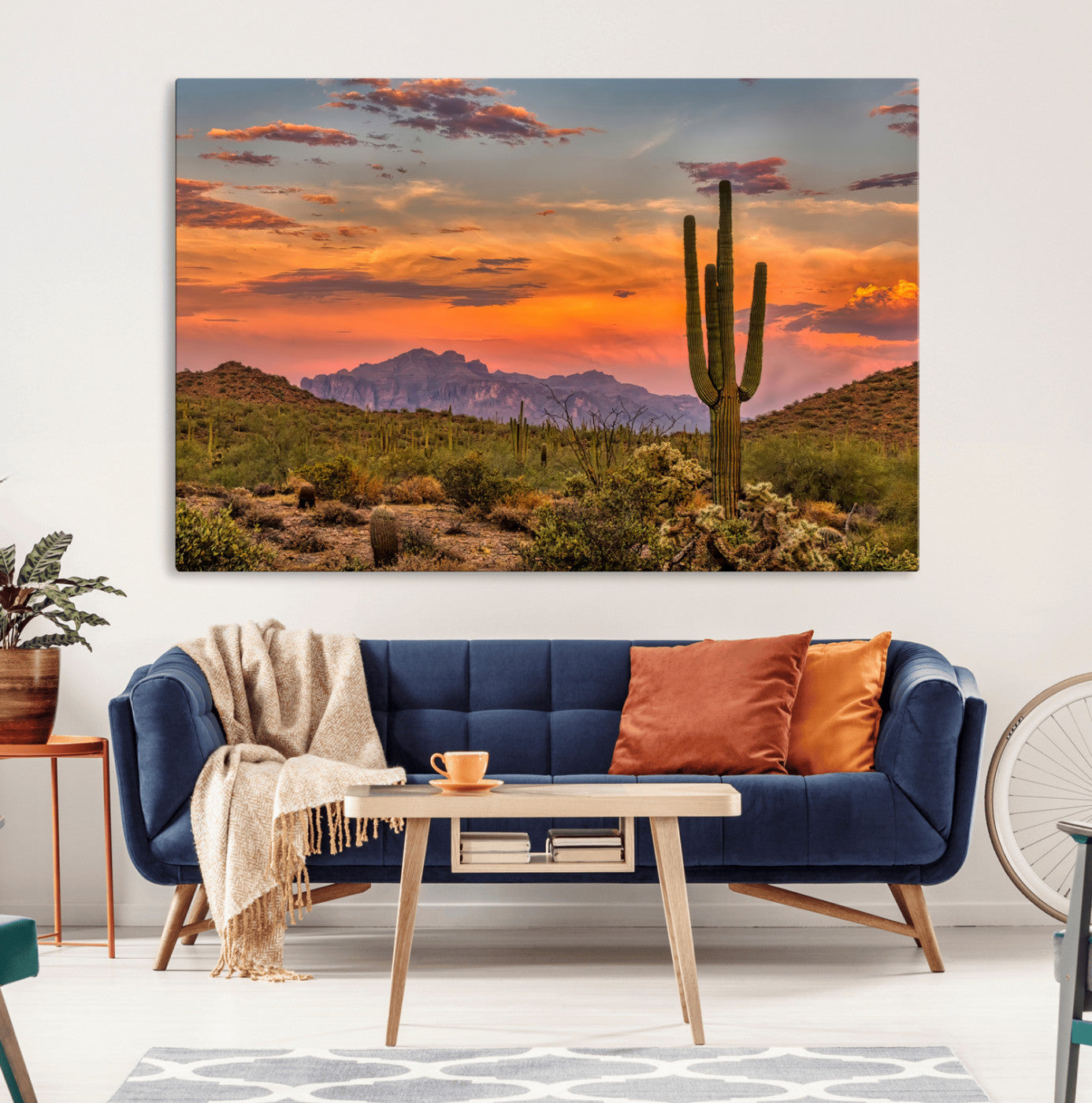 Vibrant desert sunset with saguaro cacti and distant mountains, perfect for Southwestern or warm-toned home decor.