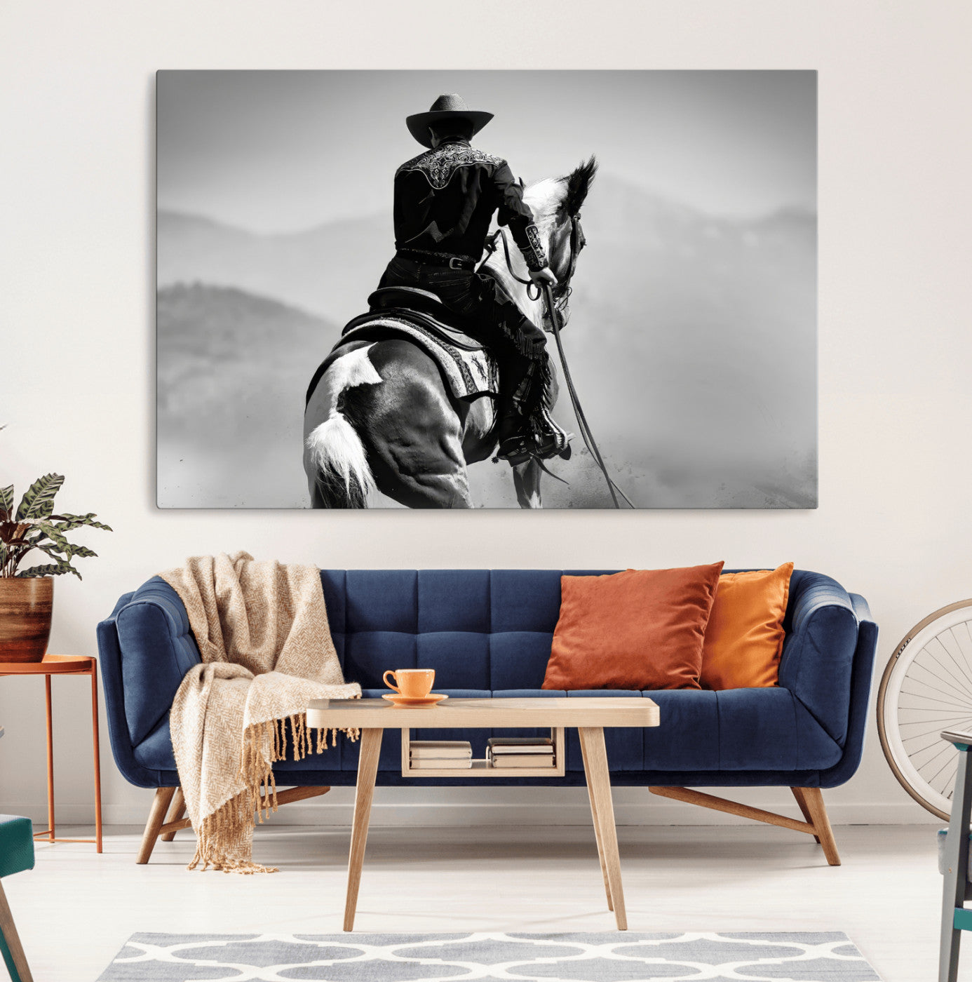 Black and white canvas of a cowboy on horseback with moody tones, perfect for rustic western or country-inspired home decor.