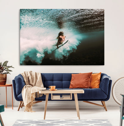 Vibrant underwater photo of a female surfer diving through turquoise waves, perfect for coastal boho or surf-inspired home decor.