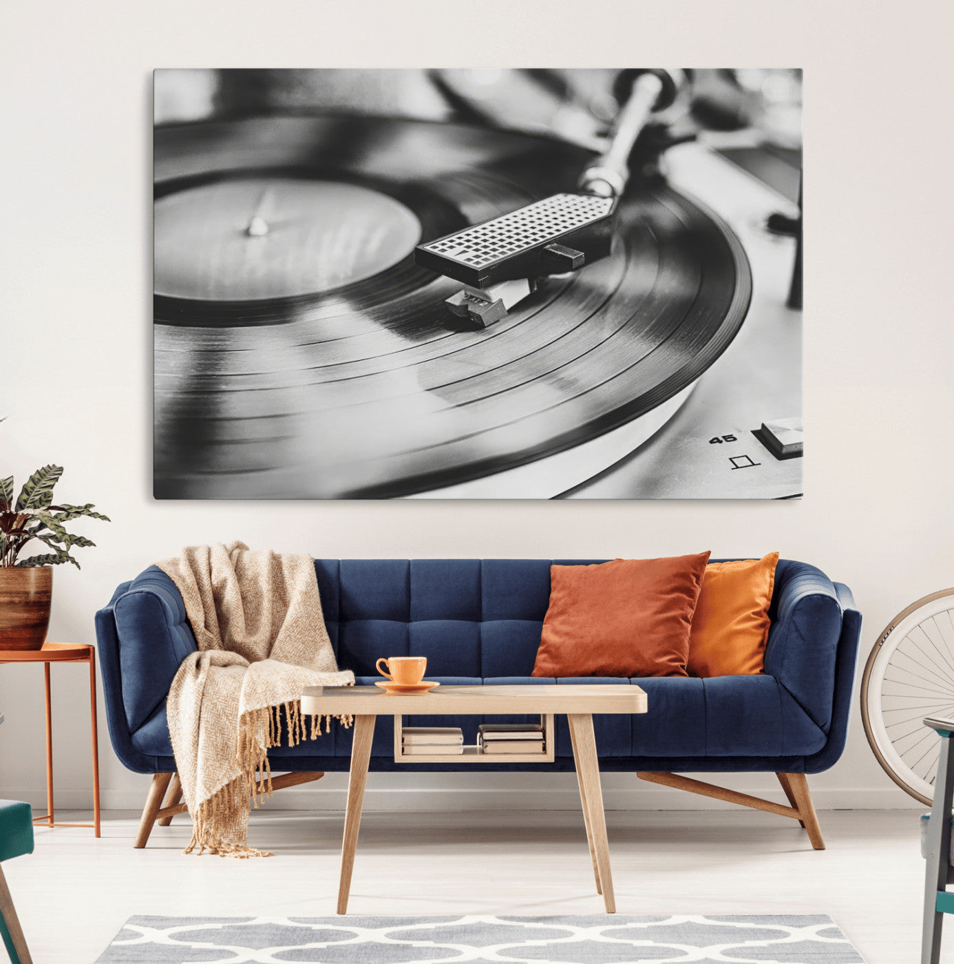 Black and white close-up of a vinyl record player with moody tones, ideal for vintage industrial or retro-style home decor.